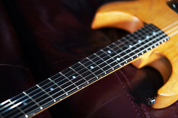Art. Classical guitar close-up. Abstract background of musical stringed instruments. Wooden...