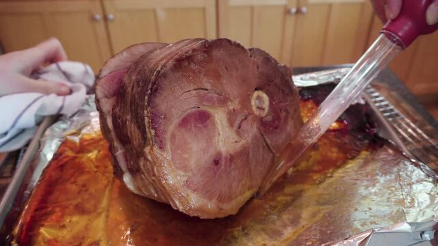 Cooking honey baked ham in a residential kitchen.