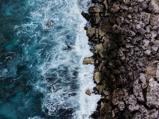 Waves hitting rocks in the bay of Cozumel in Mexico