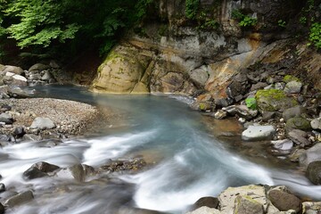 Naklejka na ściany i meble trekking around river and waterfall in summer
