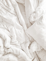 white pillows and blanket on the bed