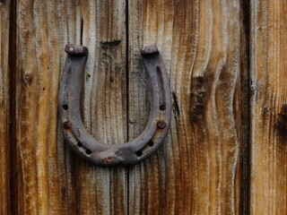 horseshoe hanging on wood door