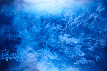Fototapeta na wymiar Blue smoke on black ink background, colorful fog, abstract swirling ocean sea, acrylic paint pigment underwater