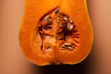 Sliced ripe pumpkin close up orange background