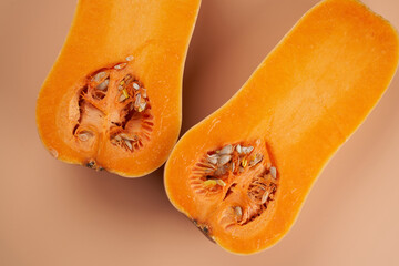 Sliced ripe pumpkin close up orange background