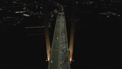 ARIAL: the Bolte Bridge in Docklands Harbour in Melbourne Australia During Night. The Bolte Bridge is a large twin cantilever road bridge in Melbourne, Victoria, Australia - Powered by Adobe