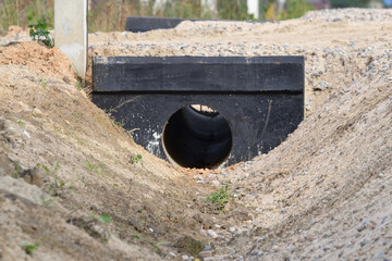 concrete drain in the hole, drainage systems under construction at the construction site on the...
