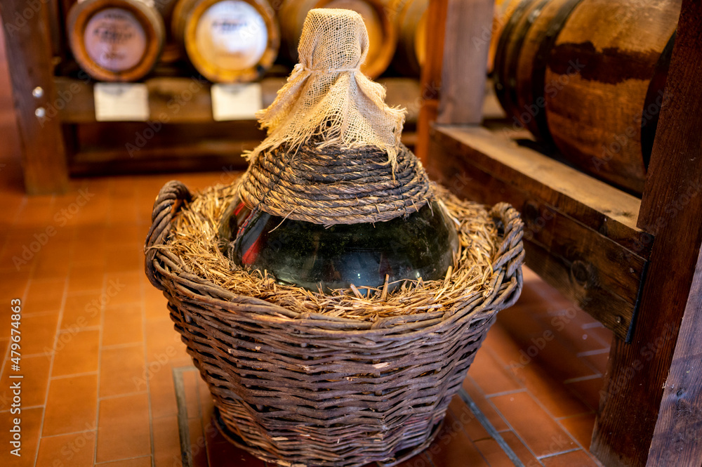 Wall mural Traditional production and aging in wooden barrels of Italian Balsamic grapes vinegar dressing in Modena, Italy