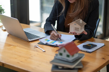Business Financing Accounting Banking Concept, businesswoman doing finances and calculate about...