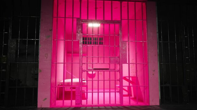 Bright pink cell in a prison block. Room designed to pacify aggressive criminals