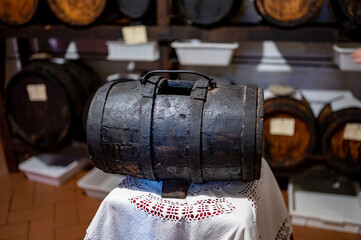 Traditional production and aging in wooden barrels of Italian Balsamic grapes vinegar dressing in Modena, Italy