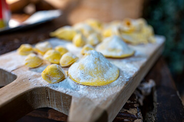 Italian food, fresh home made stuffed pasta tortelli or ravioli dumplings ready to cook, Parma, Emilia Romagna, Italy