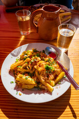 Dinner at guachinche, typical Canary Island establishment on Tenerife, where locally produced white or red wine served accompanied by homemade traditional food.