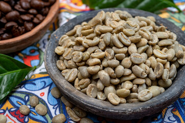 Green and roasted coffee beans from South America coffee producing region, from Colombia and Brazil with  mountain ranges and climate ideal for coffee growing