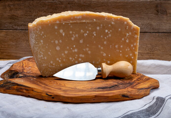 72 months very old Italian parmigiano-reggiano parmesan cheese from Parma has amber color, dry,...