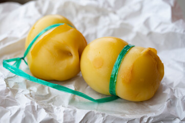 Italian cheeses collection, smoked scamorza pear shaped cheese from small cheese farm in South Italy