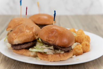 Order of hamburger sliders with delicious meat and served with tater tots for some great comfort...
