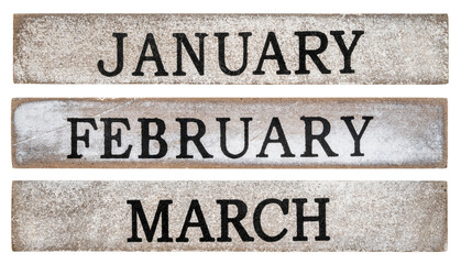 January, February and March months - rough text on grunge wooden blocks isolated on white