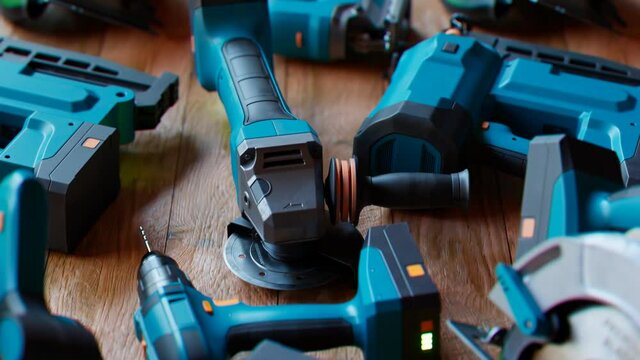Cordless Power Tools Collection on Wooden Workshop Floor