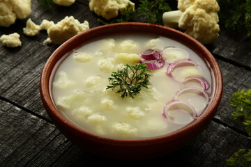Bowl of delicious homemade cauliflower  vegetable fresh cream soup .
