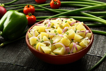 Potato salad with organic herbs and vegetables.