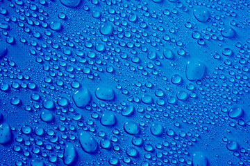 Transparent clear blue liquid serum gel smudge with bubbles textured background