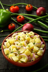 Potato salad with organic herbs and vegetables.