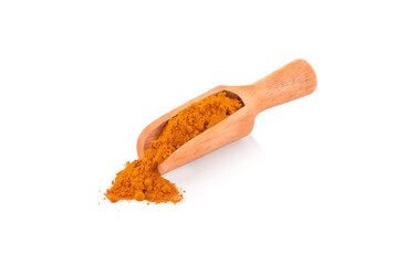 Turmeric powder in spoon isolated on white background.