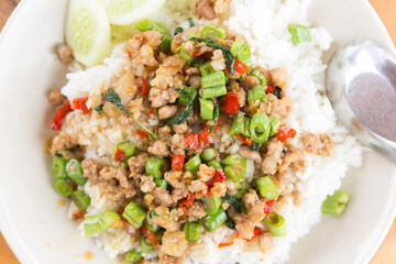 Rice topped with stir-fried pork and basil