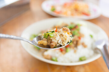 Rice topped with stir-fried pork and basil