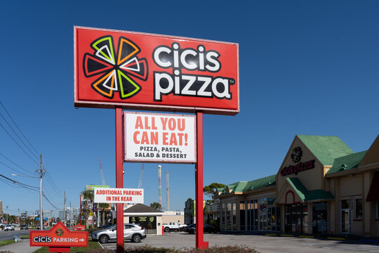 Orlando, Fl, USA - January 6, 2022: A Cicis restaurant pole sign with blue sky in background. Cicis is an American chain of buffet restaurants. 