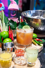 Cocktail Tom Yum drink, Made with vodka mixed with Thai herbs, lime, lemongrass, chili, galangal, kaffir lime leaves and cane sugar, delicious, fragrant, Thai style