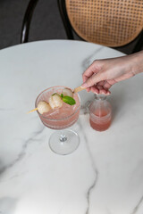 Fresh juicy lychee fruit on a glass plate. Peeled lychee fruit.