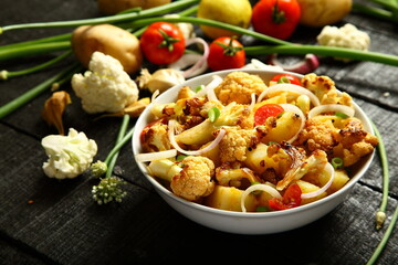Healthy vegetarian curry meal- cauliflower roast with exotic Indian spices and herbs.