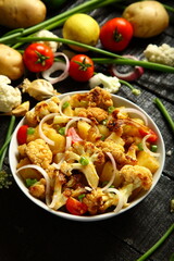 Healthy vegetarian curry meal- cauliflower roast with exotic Indian spices and herbs.