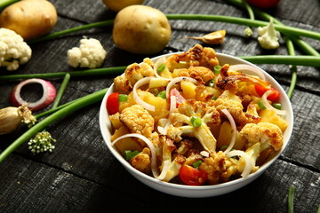 Healthy vegan appetizer, homemade roasted cauliflower - vegetarian curry dishes,