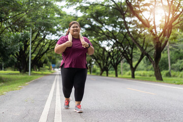 Fat woman asian running at the park, Does exercise for weight loss idea concept.
