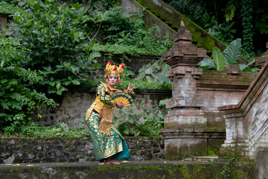 Balinese dancer woman in gold costume, Temple Bali Indonesia
