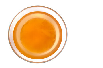 Kombucha in a glass cup on a white background,healthy and delicious drink top view.