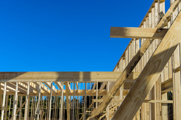 Exterior view of a new house under construction framing