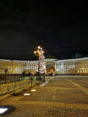 Palace Square of St. Petersburg, the General Headquarters, a beautiful lantern and natural spruce, decorated in a retro style on a dark winter morning