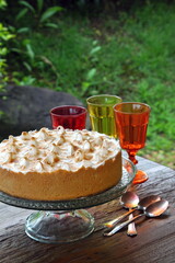 Lemon pie with whipped cream on the table