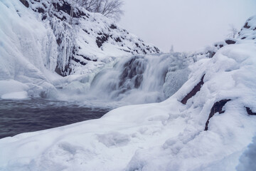 Fototapeta na wymiar Visimo-Utkinsky waterfall in winter. Russia
