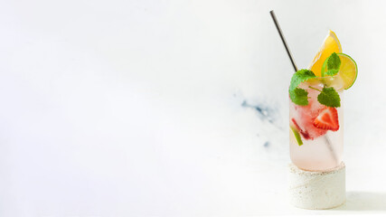  Cooling lemonade banner with strawberries and mint in a glass. Copy space.