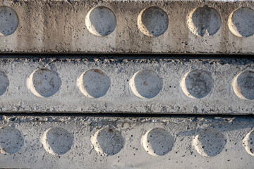 Closeup gray cement wall with stains and chips. Texture of an industrial old wall
