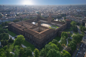 Castello Sforzesco morning sunrise aerial view. The main Italian castle in Milan. The residence of the dukes of Milan of the Sforza dynasty in Milan. Top view of the Sforzesco castle in Milan Italy.