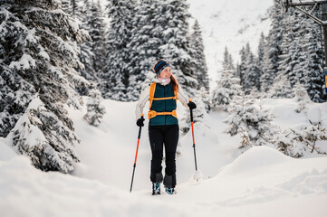 Mountaineer backcountry ski walking ski alpinist in the mountains. Ski touring in alpine landscape...