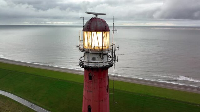 Lighthouse tower Lange Jaap in Den Helder drone aerial footage along the sea near the island of Texel in North Holland, The Netherlands.