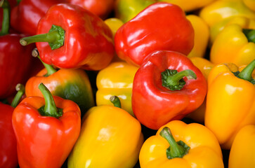 Group of red and yellow bell peppers.