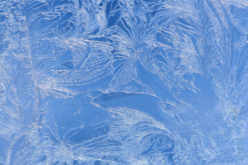 Ice patterns on glass. Background image. A closeup with soft focus.
